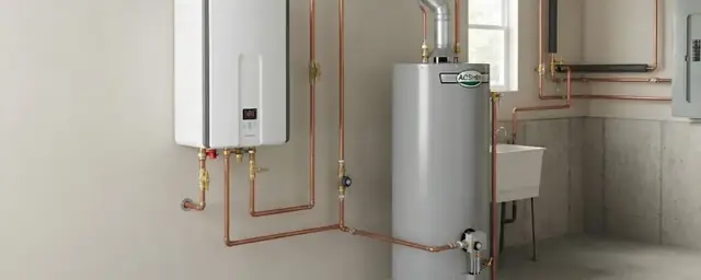 Wall-mounted tankless water heater beside a tank heater with copper piping